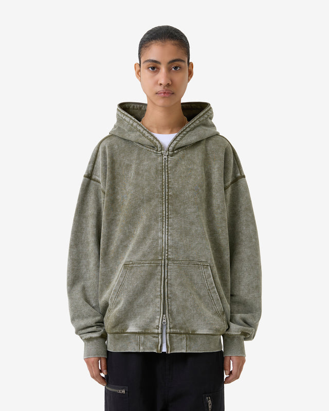 Person wearing a gray hoodie on a white background