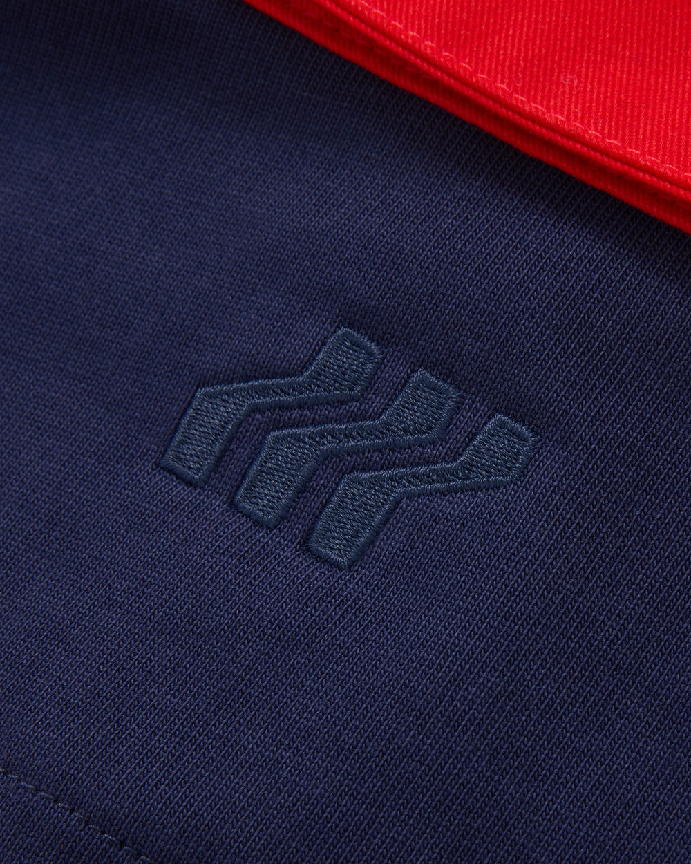 Navy long-sleeve polo shirt with red collar and 'BOXFRESH' branding on a white background