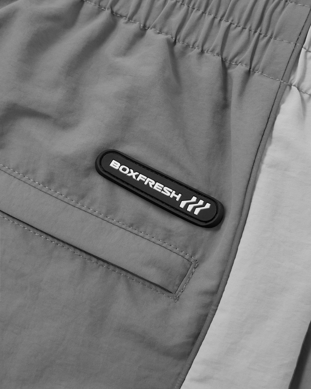 Gray sweatpants with a logo on a white background