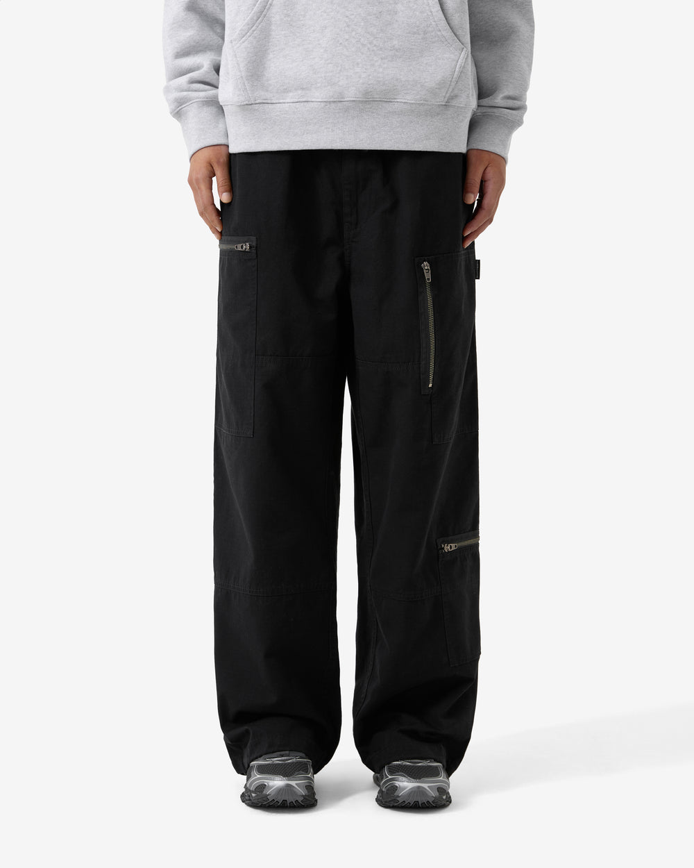 Black pants with zippers on a white background