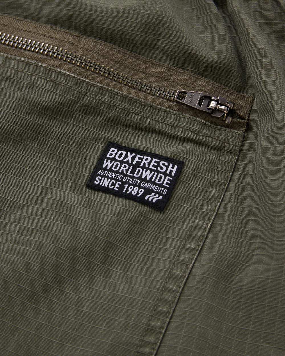 Green cargo pants on a white background
